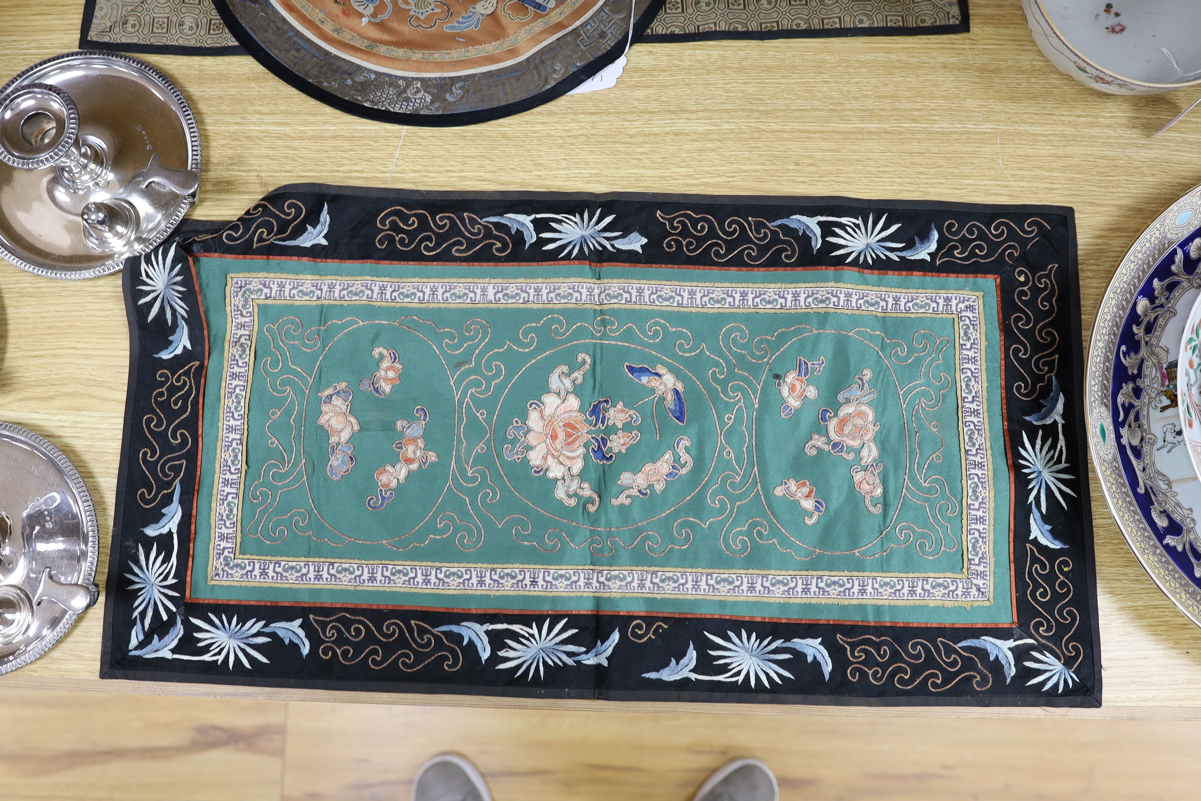 Three Chinese embroidered panels, one embroidered with Chinese knot